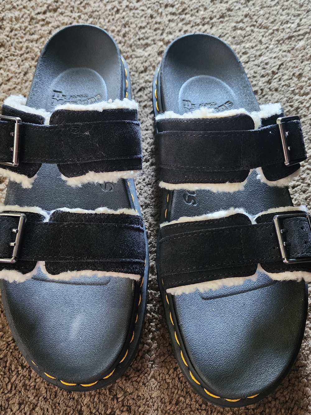 Dr. Martens Black Faux-Shearling Buckle Slide Sandals.